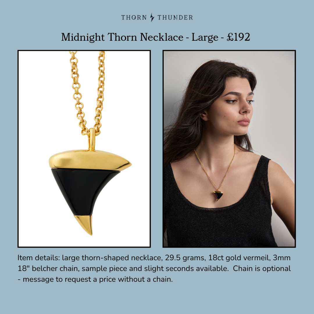 Midnight Thorn Necklace on clean white cut out and on model with brunette hair.