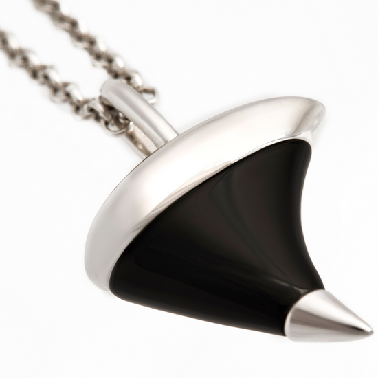 Black and silver pendant on a white background