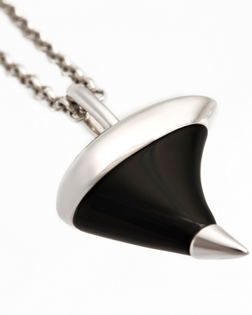 Black and silver pendant on a white background